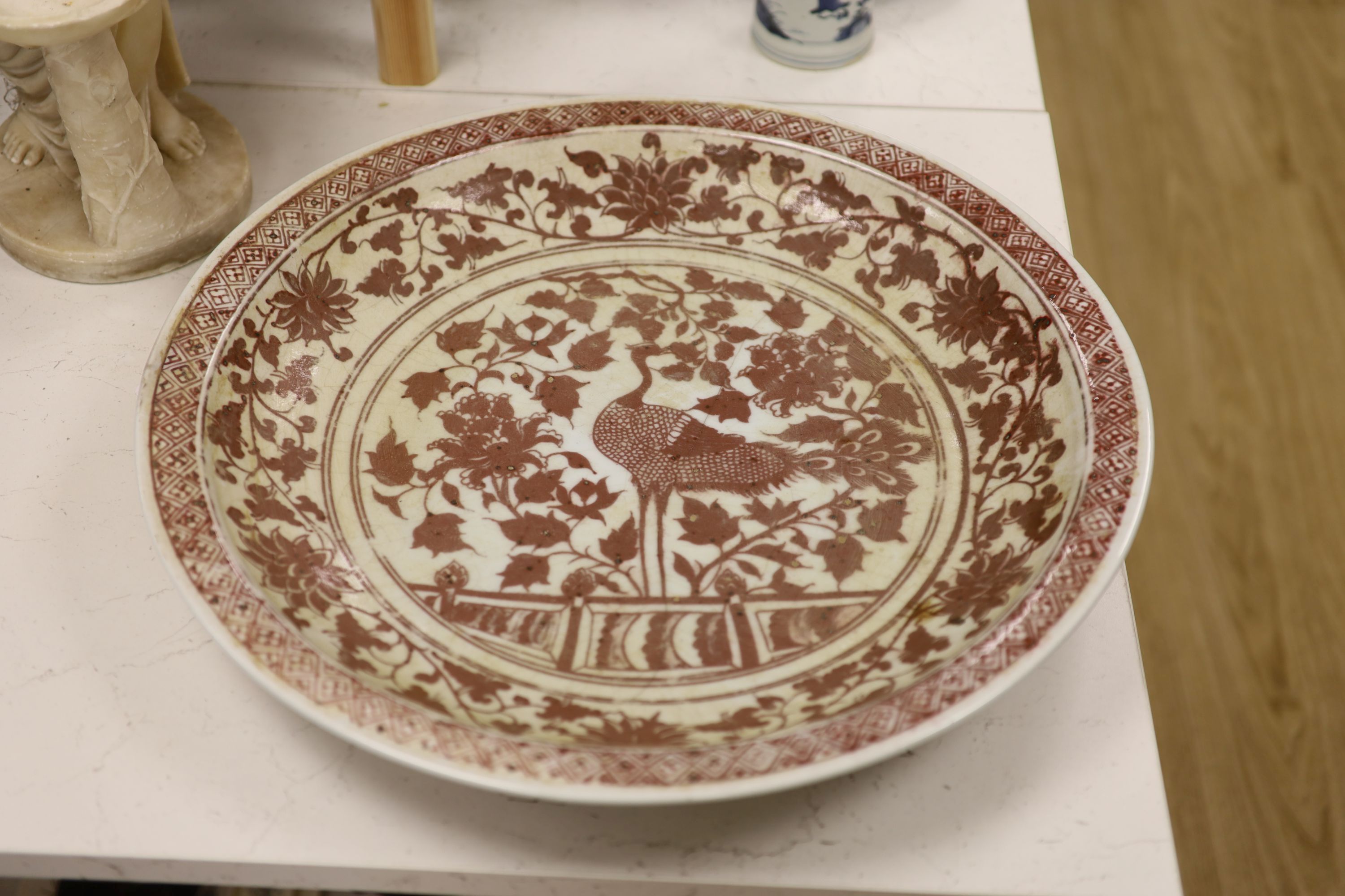 A large Chinese underglaze copper red charger, diameter 53cm